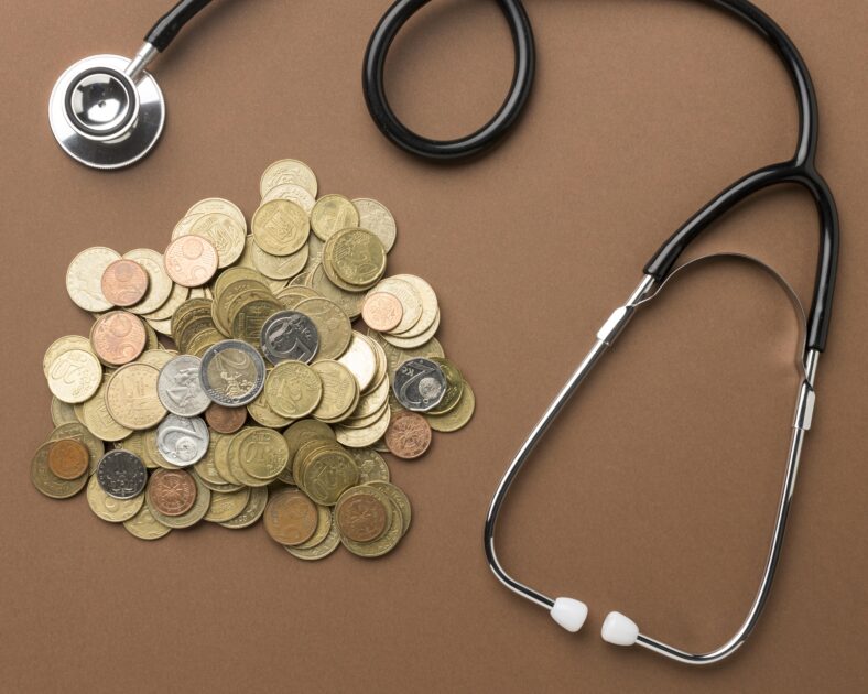 bunch coins arrangement with stethoscope